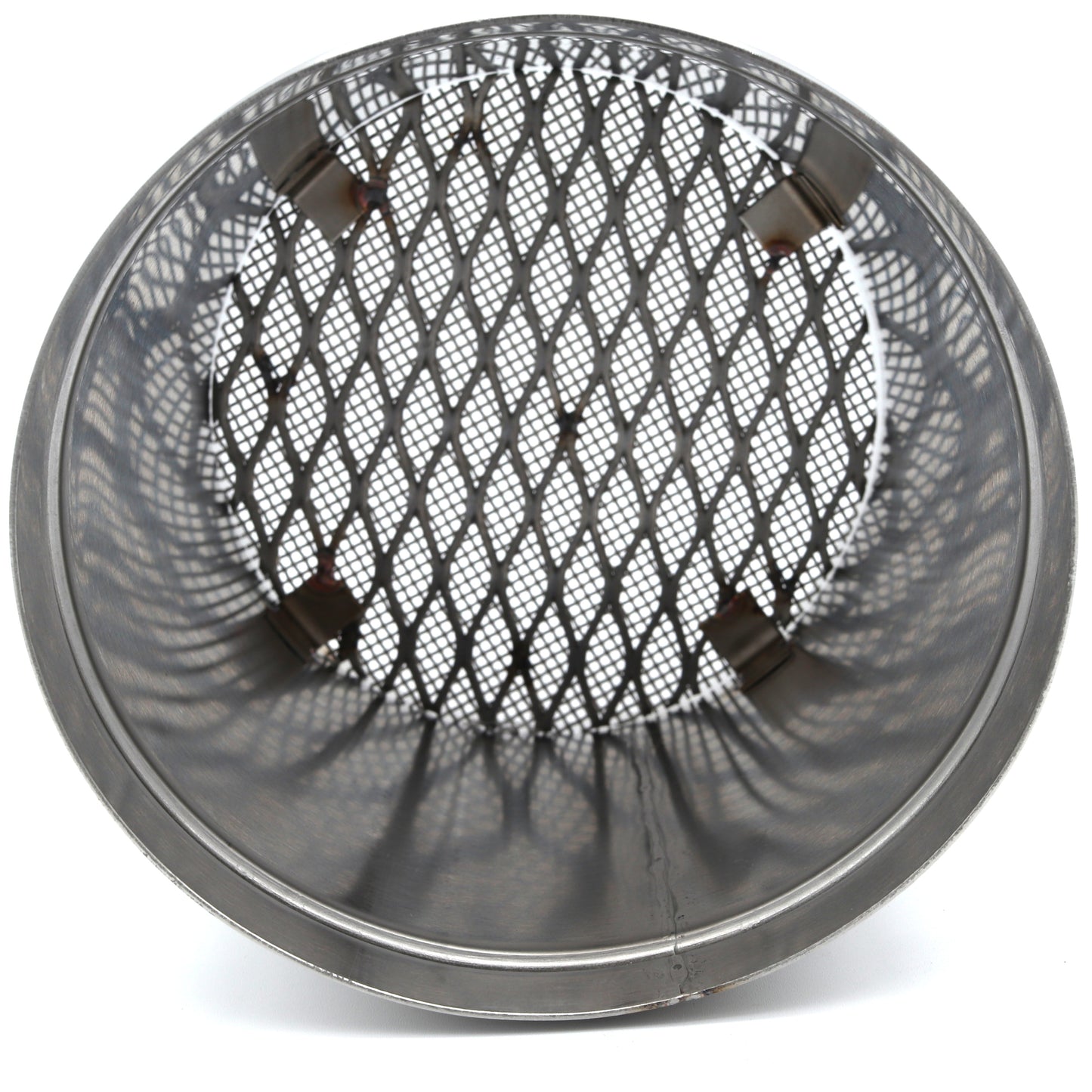 Round metal mesh screen on a white background