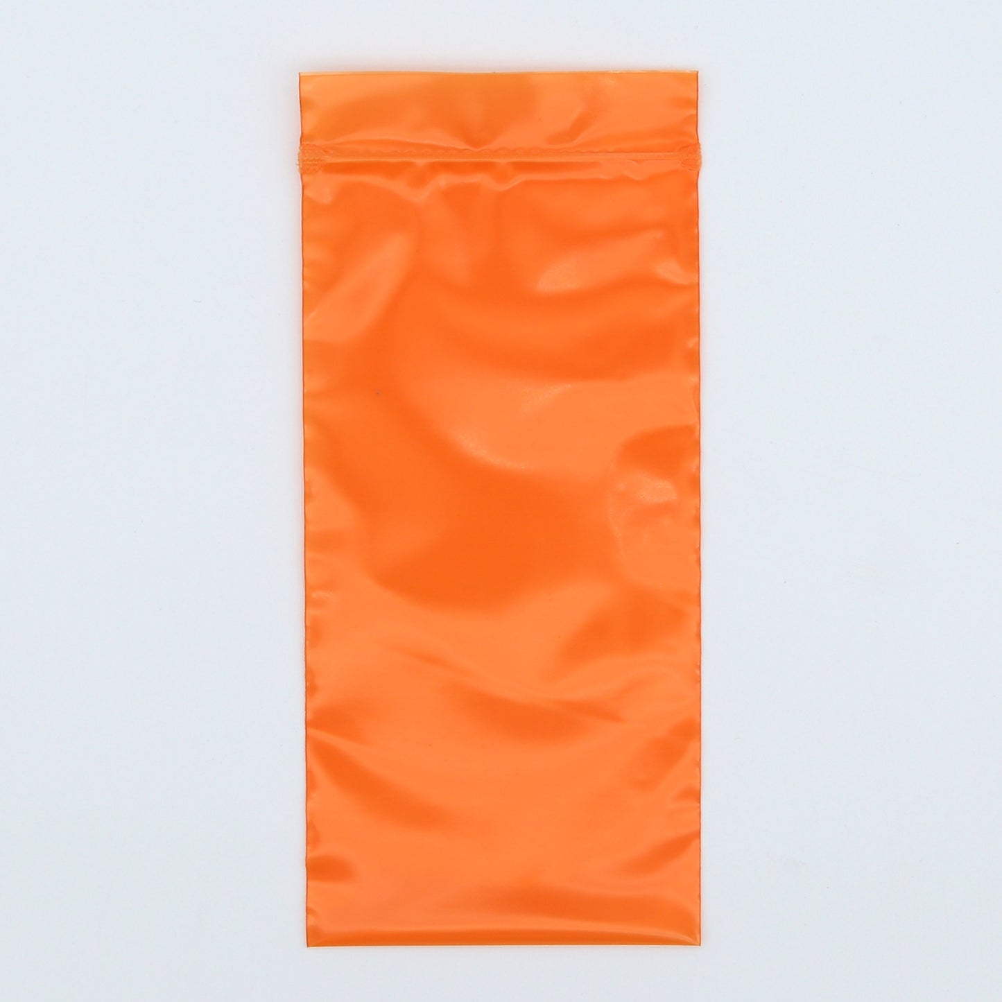 Orange towel on a light gray background