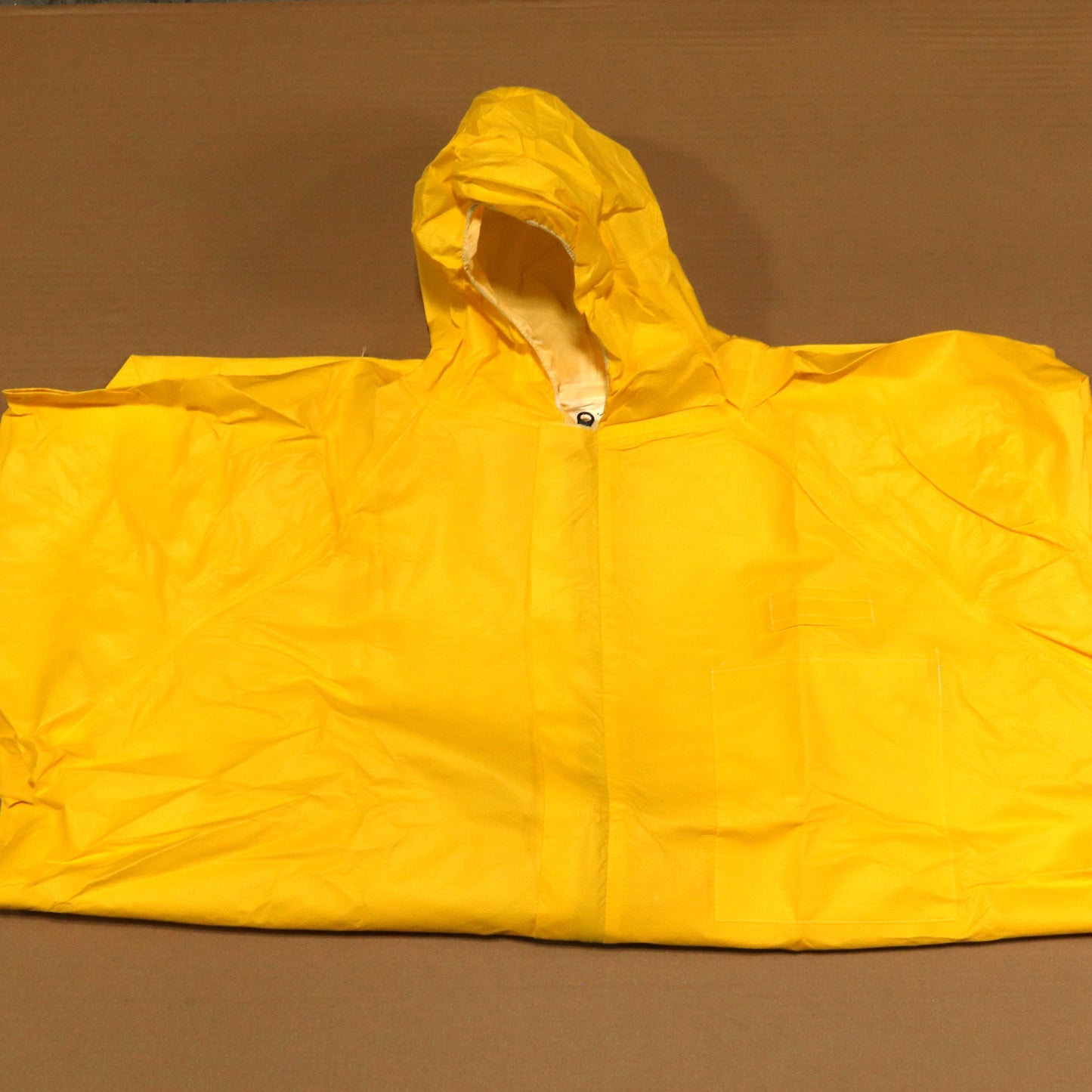 Yellow raincoat on a brown background