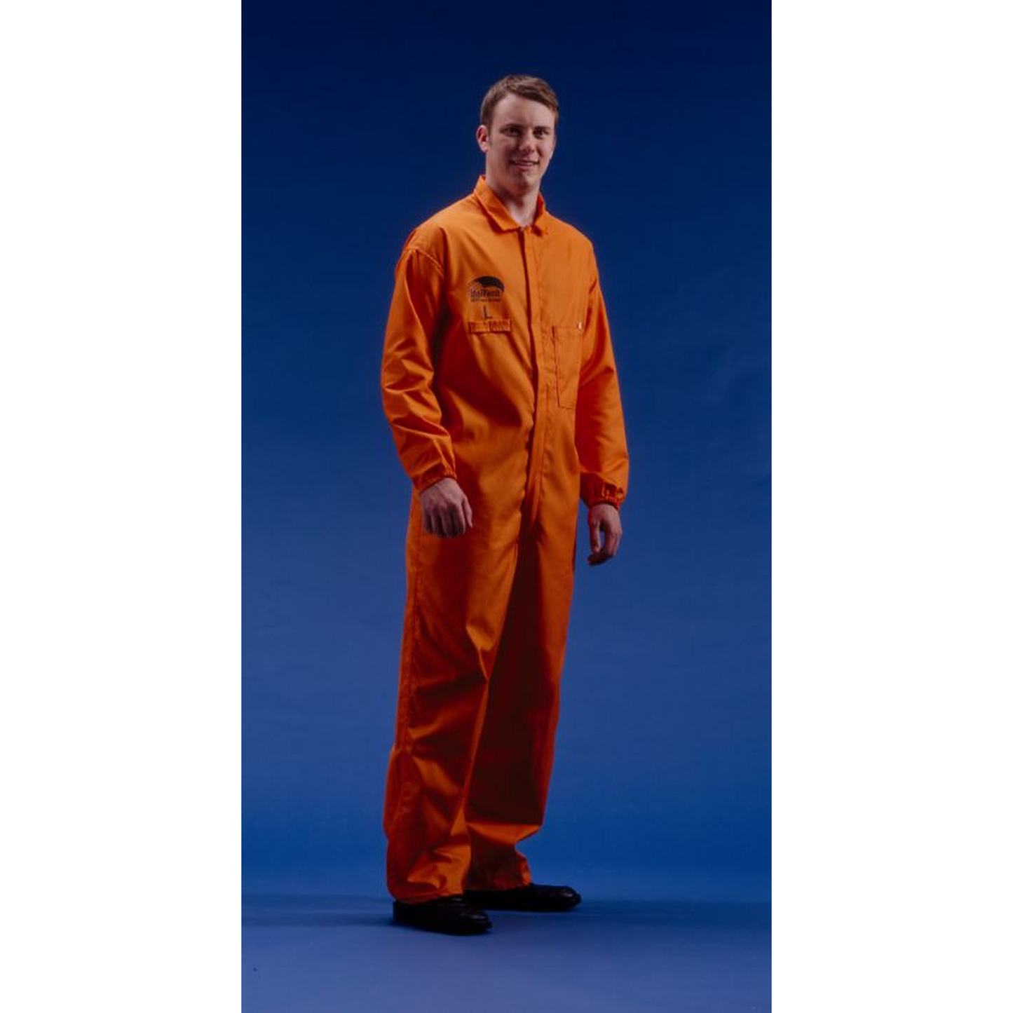 Person wearing an orange coverall on a blue background