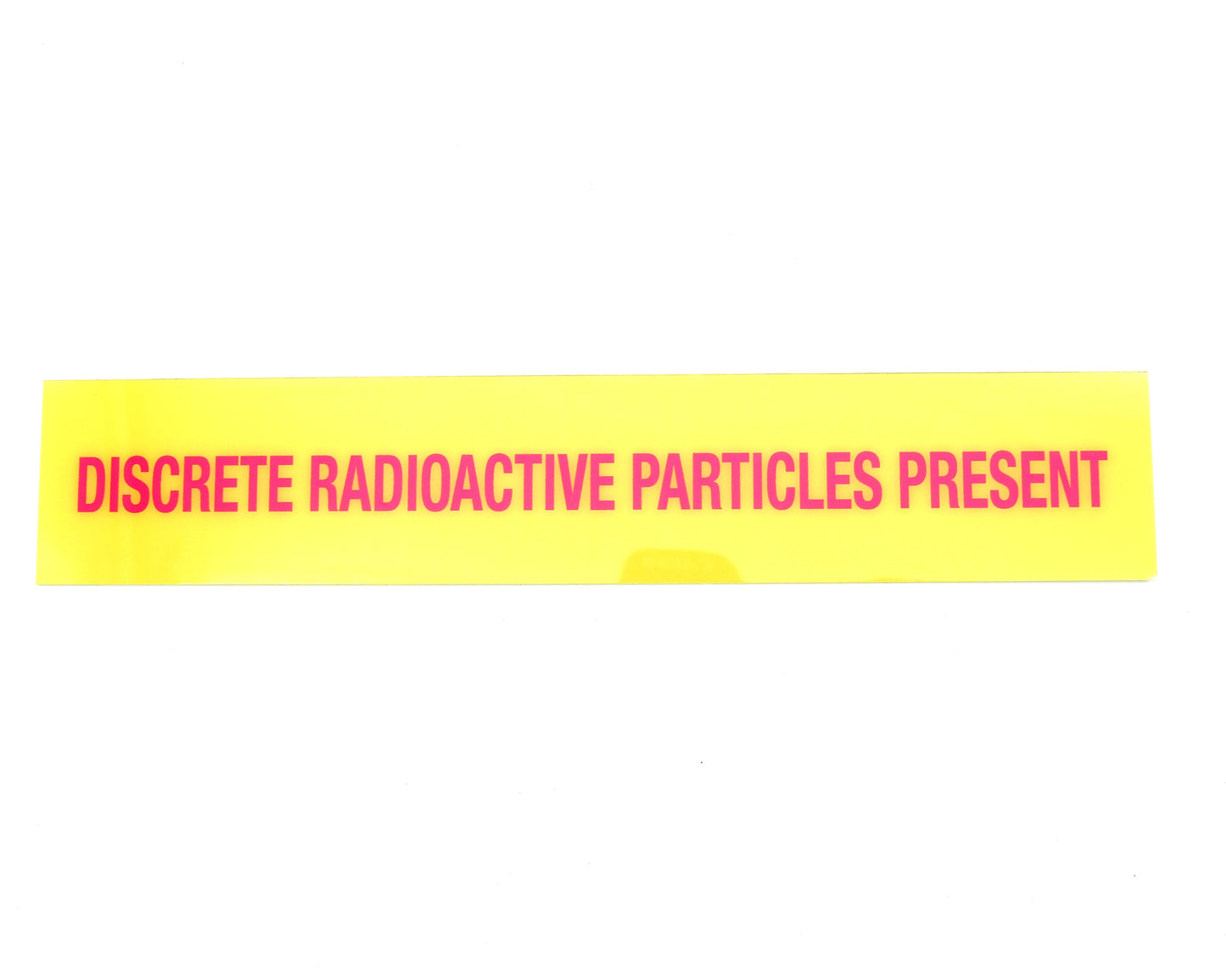 Yellow warning label with red text on a white background