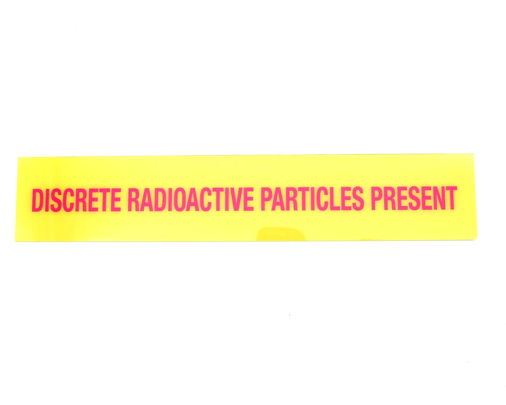 Yellow warning label with red text on a white background