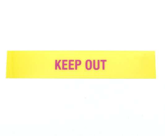 Yellow warning label with 'KEEP OUT' text on a white background