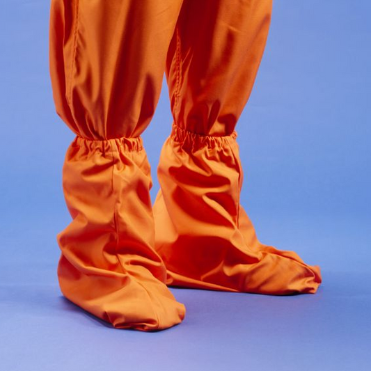 Orange shoe covers on a blue background
