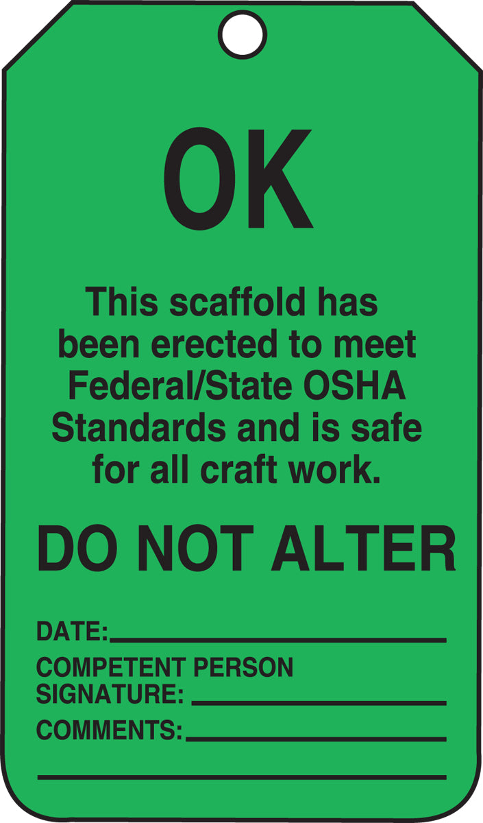 Green tag with black text indicating compliance with OSHA standards for a scaffold.