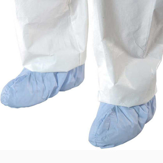Blue foot covers over white pants on a white background