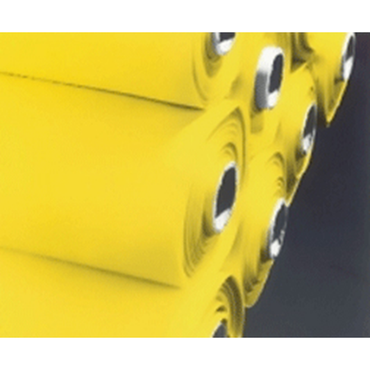 Close-up of yellow rolls of fabric on a dark background