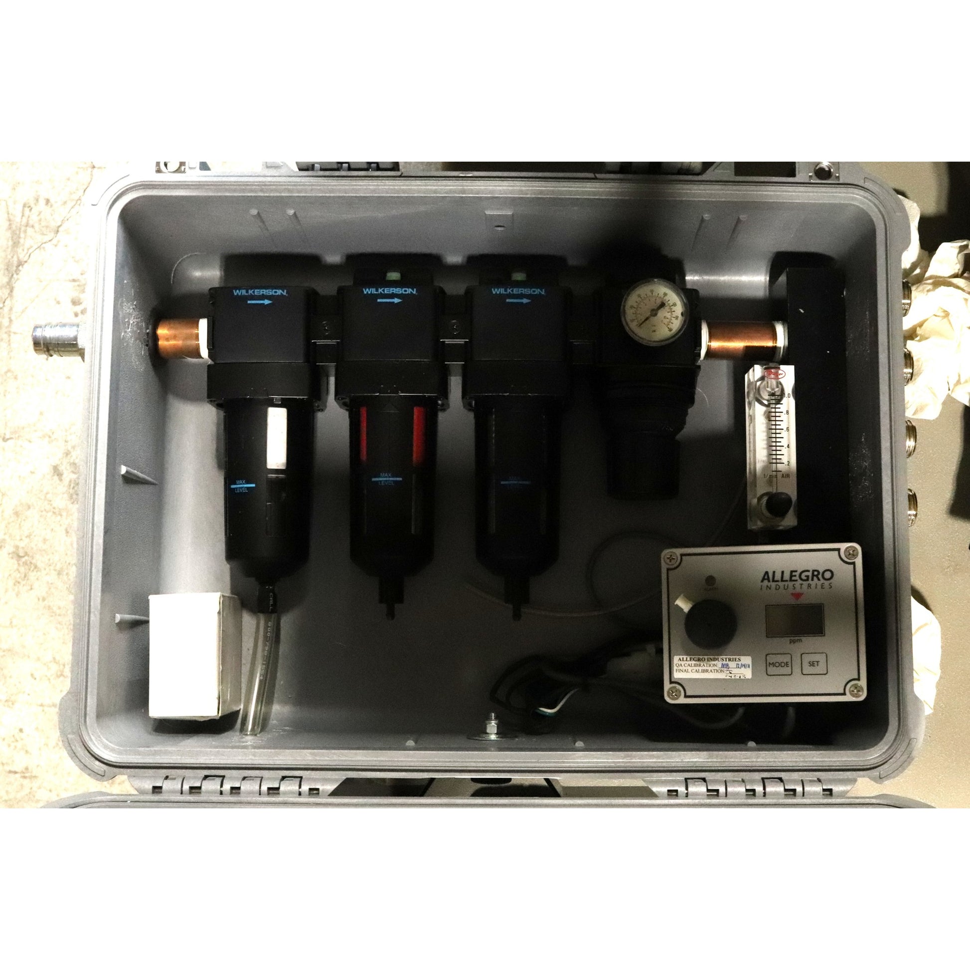 Technical equipment with components inside a metal case, featuring the Allegro brand.