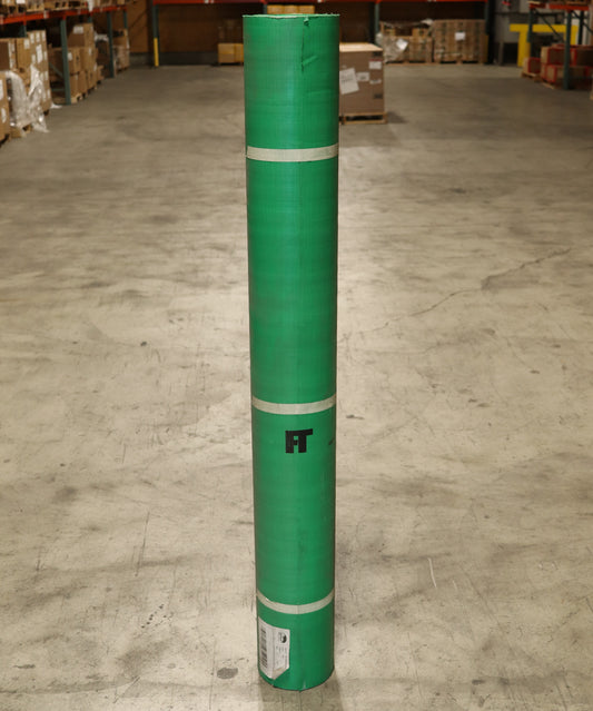 Green roll of paper with a logo on a warehouse floor