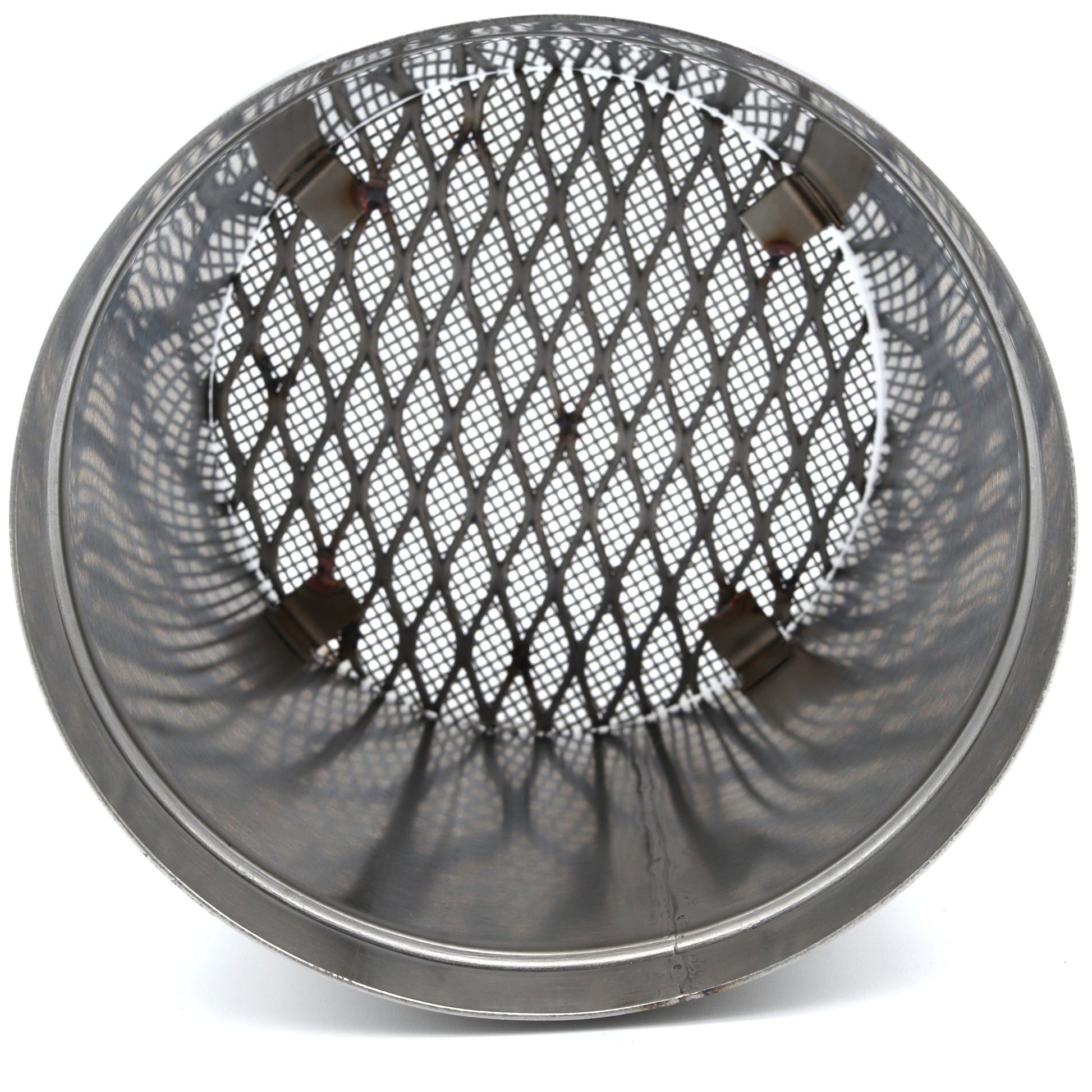 Round metal mesh screen on a white background
