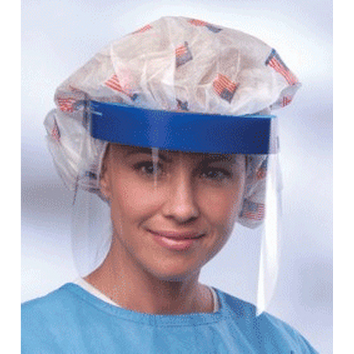 Person wearing a hairnet and face shield with a blue shirt on a white background