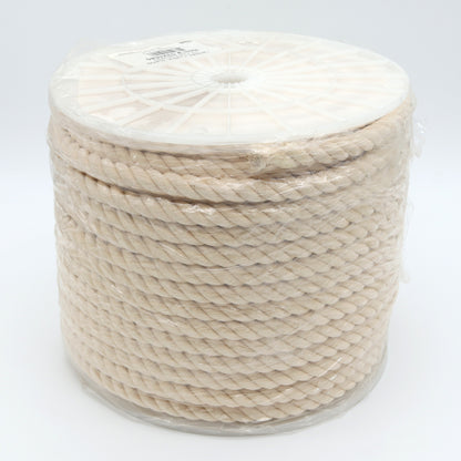 Spool of beige rope on a white background