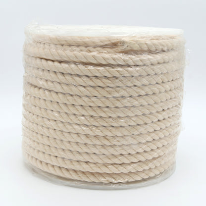Spool of beige rope on a white background