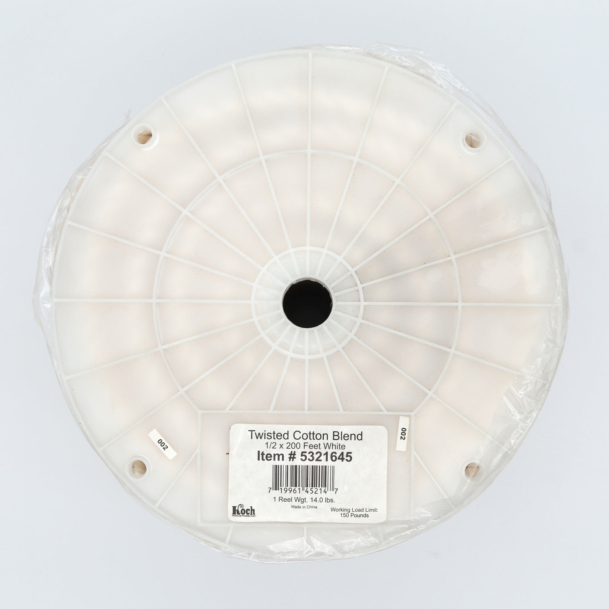 Spool of twisted cotton blend on a white background