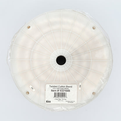 Spool of twisted cotton blend on a white background
