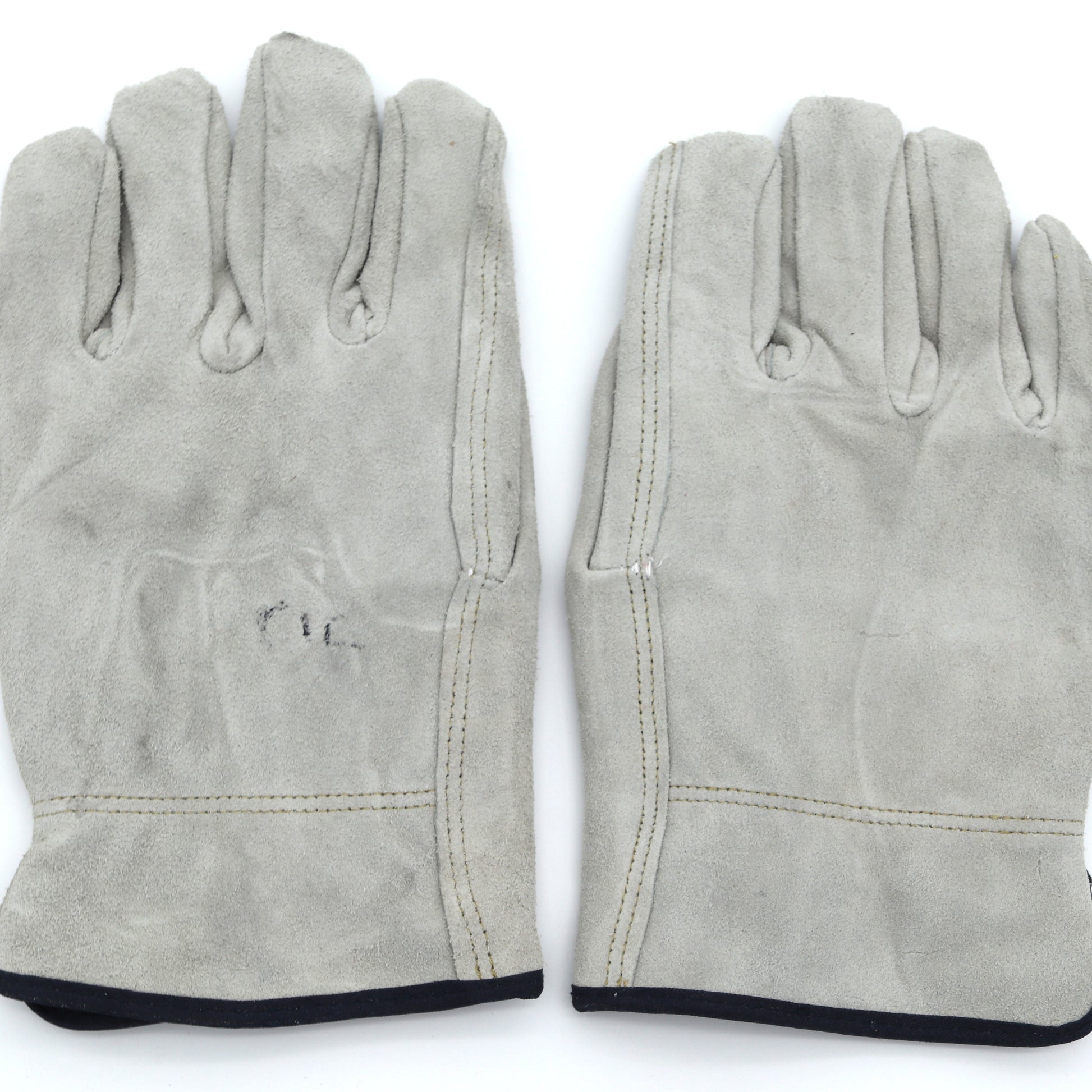 Pair of gray leather gloves on a white background