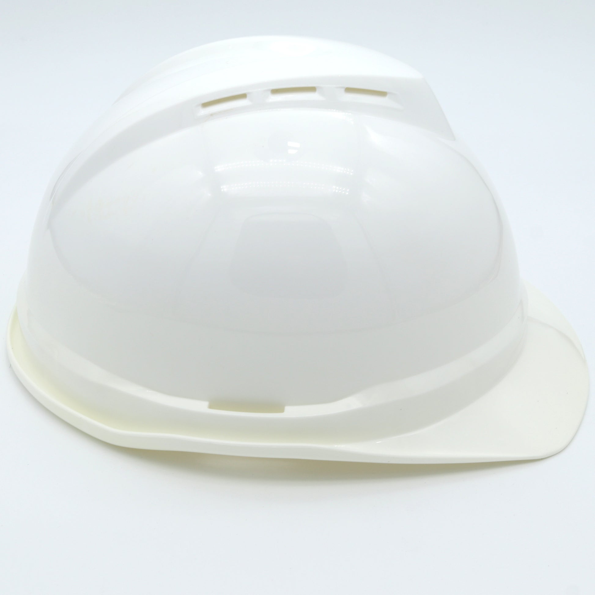 White plastic hard hat on a white background