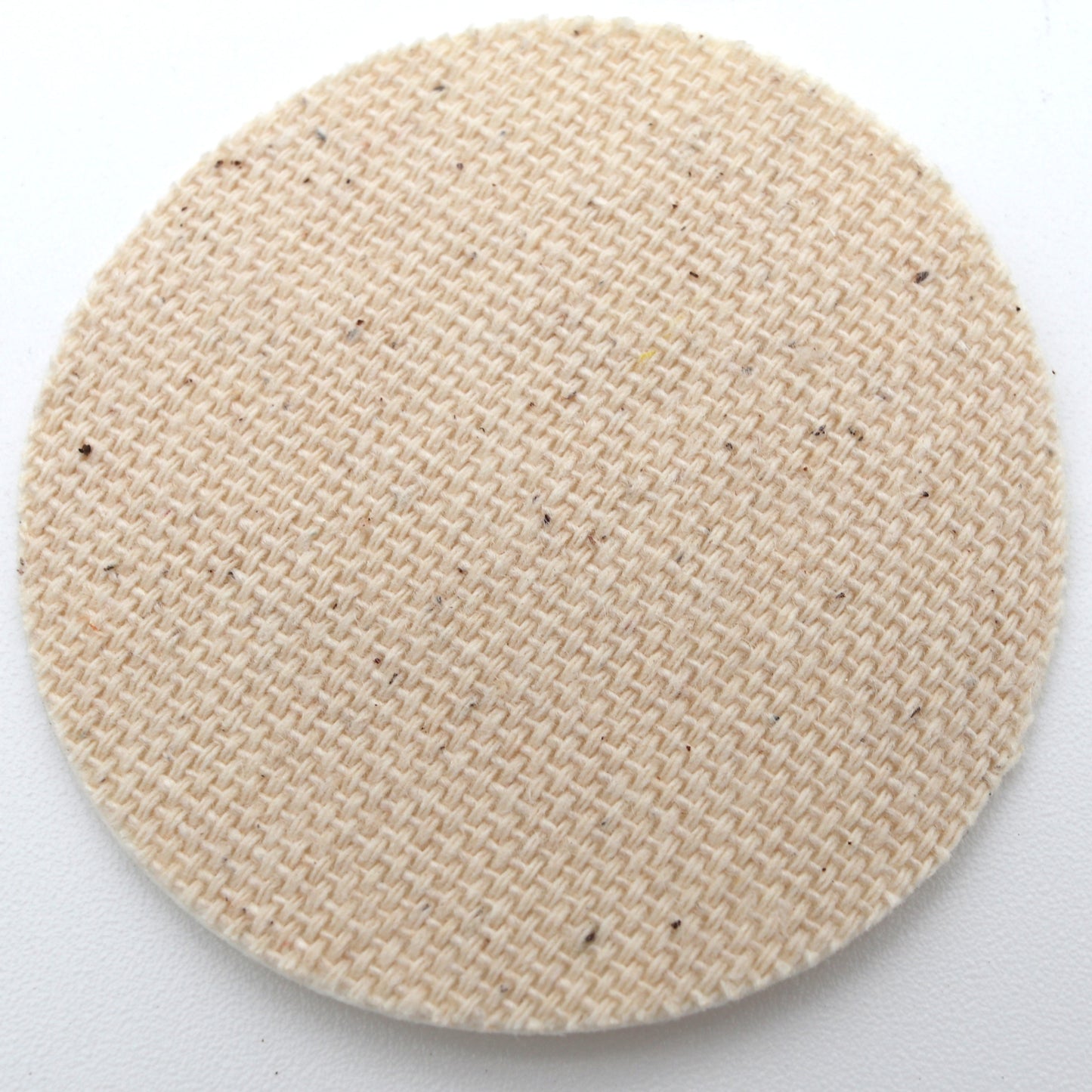 Round beige woven smear on a white background