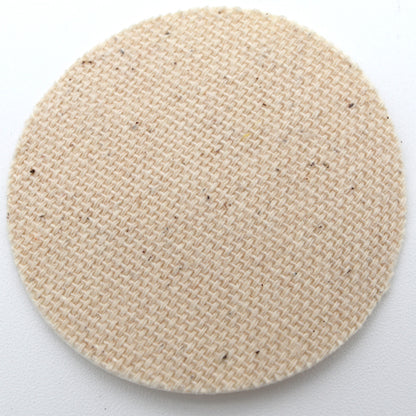 Round beige woven smear on a white background