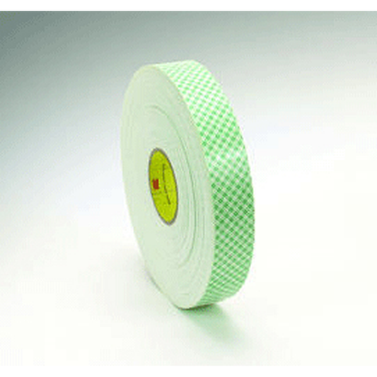 Roll of green tape with a checkered pattern on a white background
