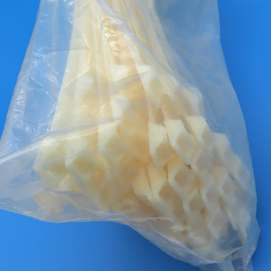 Bag of white zip ties against a blue background