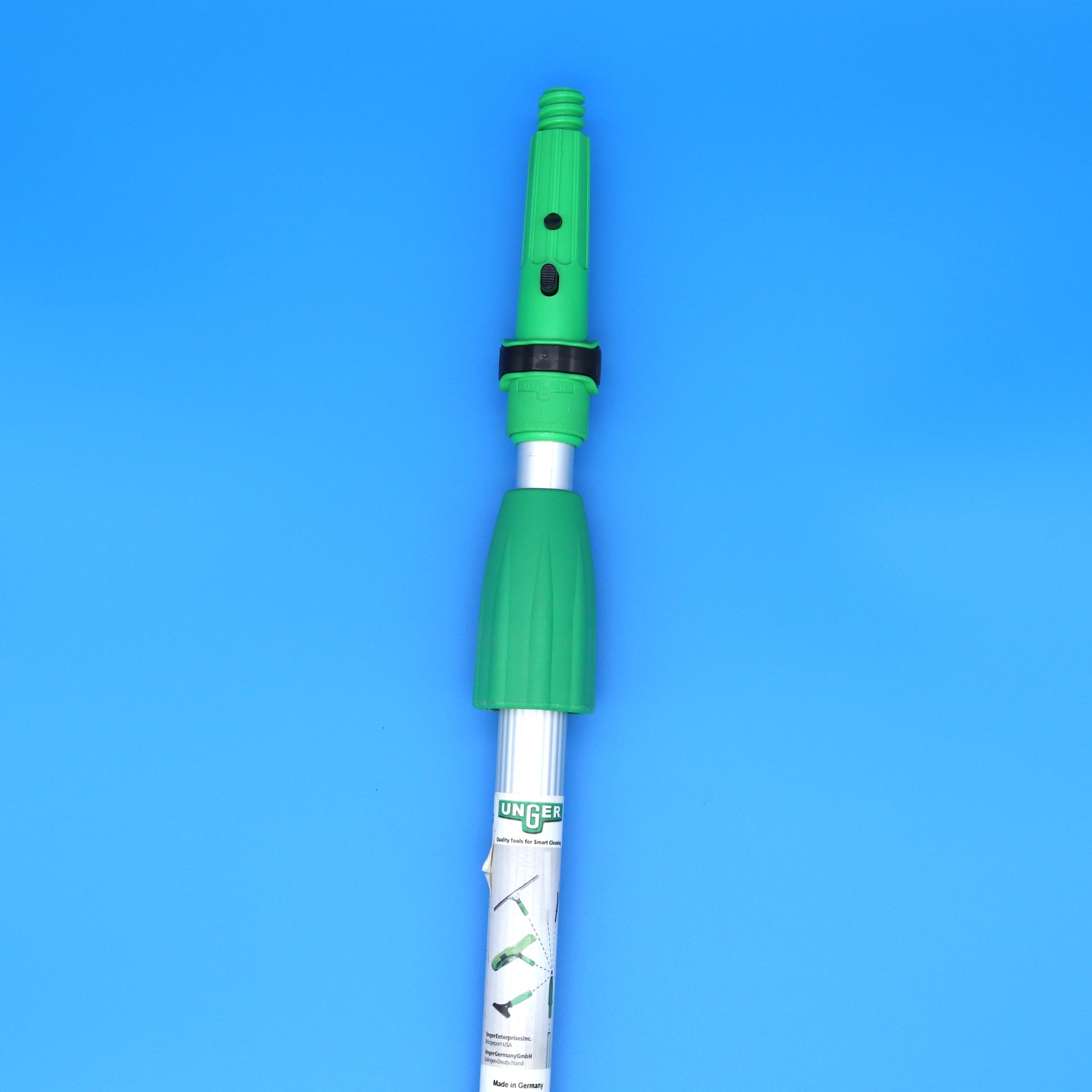 Green and silver telescopic pole on a blue background