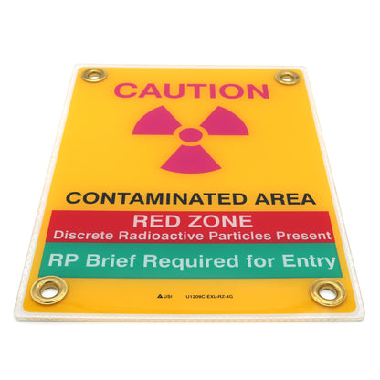 Radiation warning sign with caution and red zone text on a yellow background