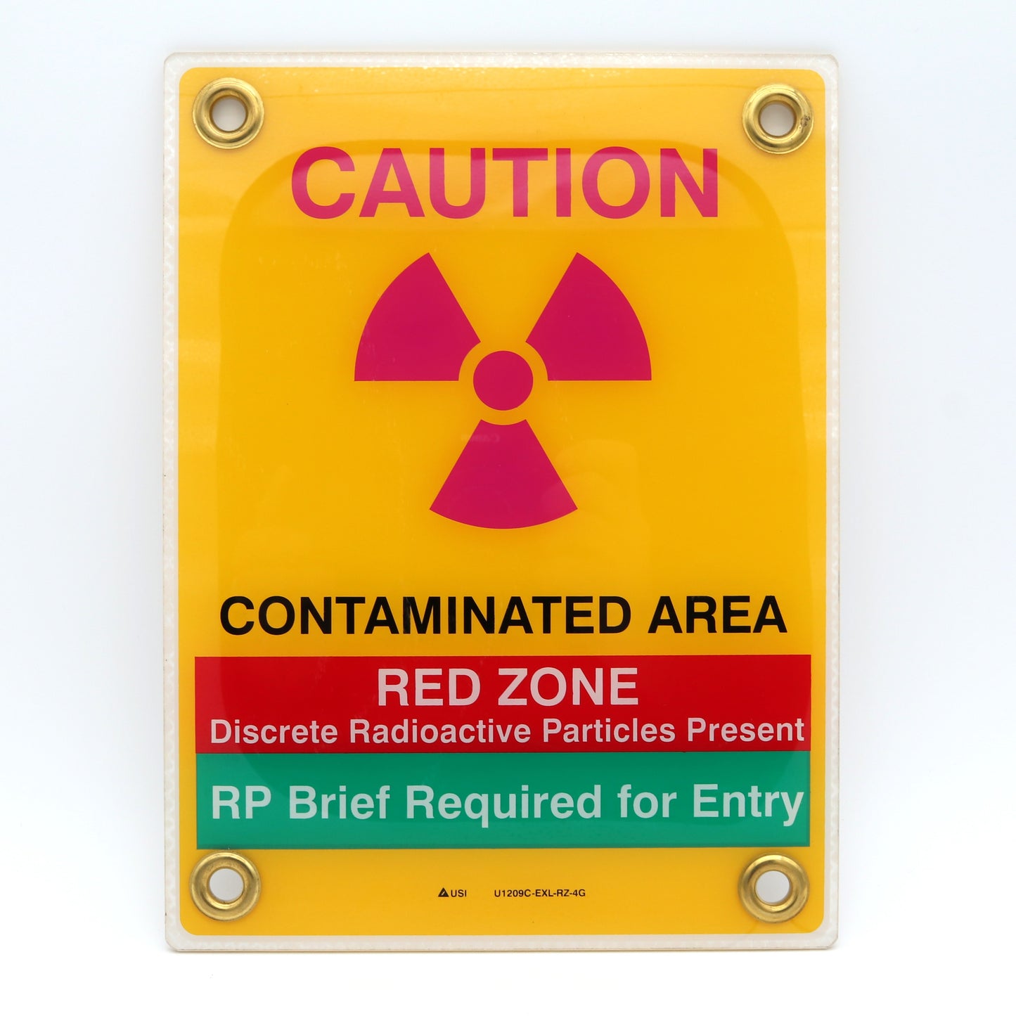 Warning sign indicating a contaminated area with radioactive particles.