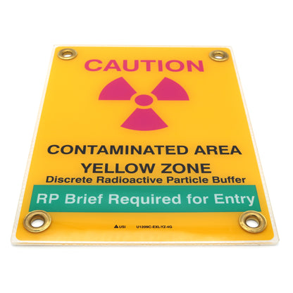 Warning sign indicating a contaminated area with radiation symbol on a yellow background