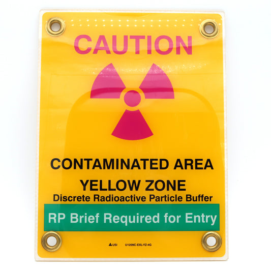 Warning sign indicating a contaminated area with radioactive symbol on a yellow background