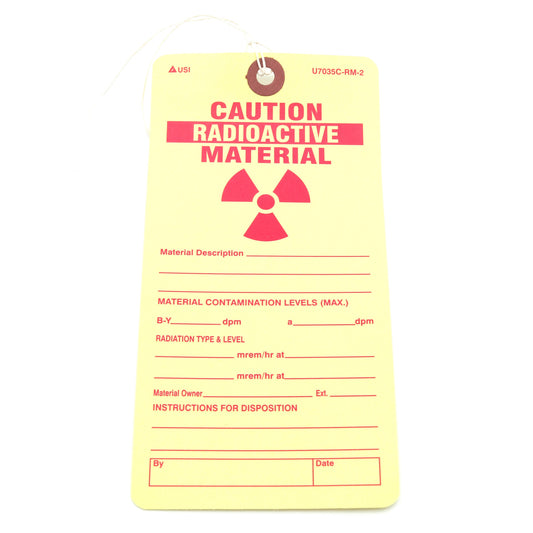 Yellow radioactive material tag on a white background