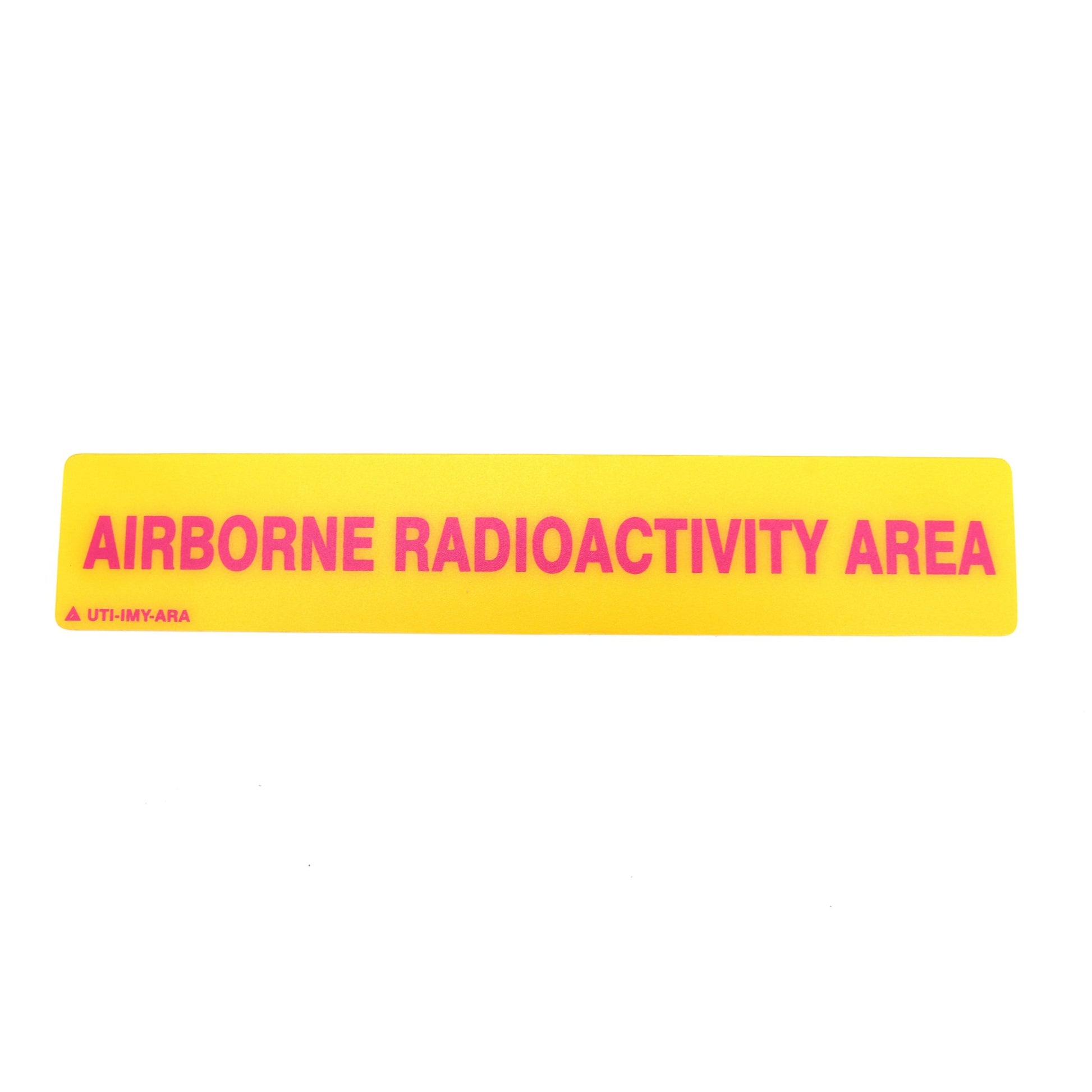 Yellow warning label with 'AIRBORNE RADIOACTIVITY AREA' text on a white background