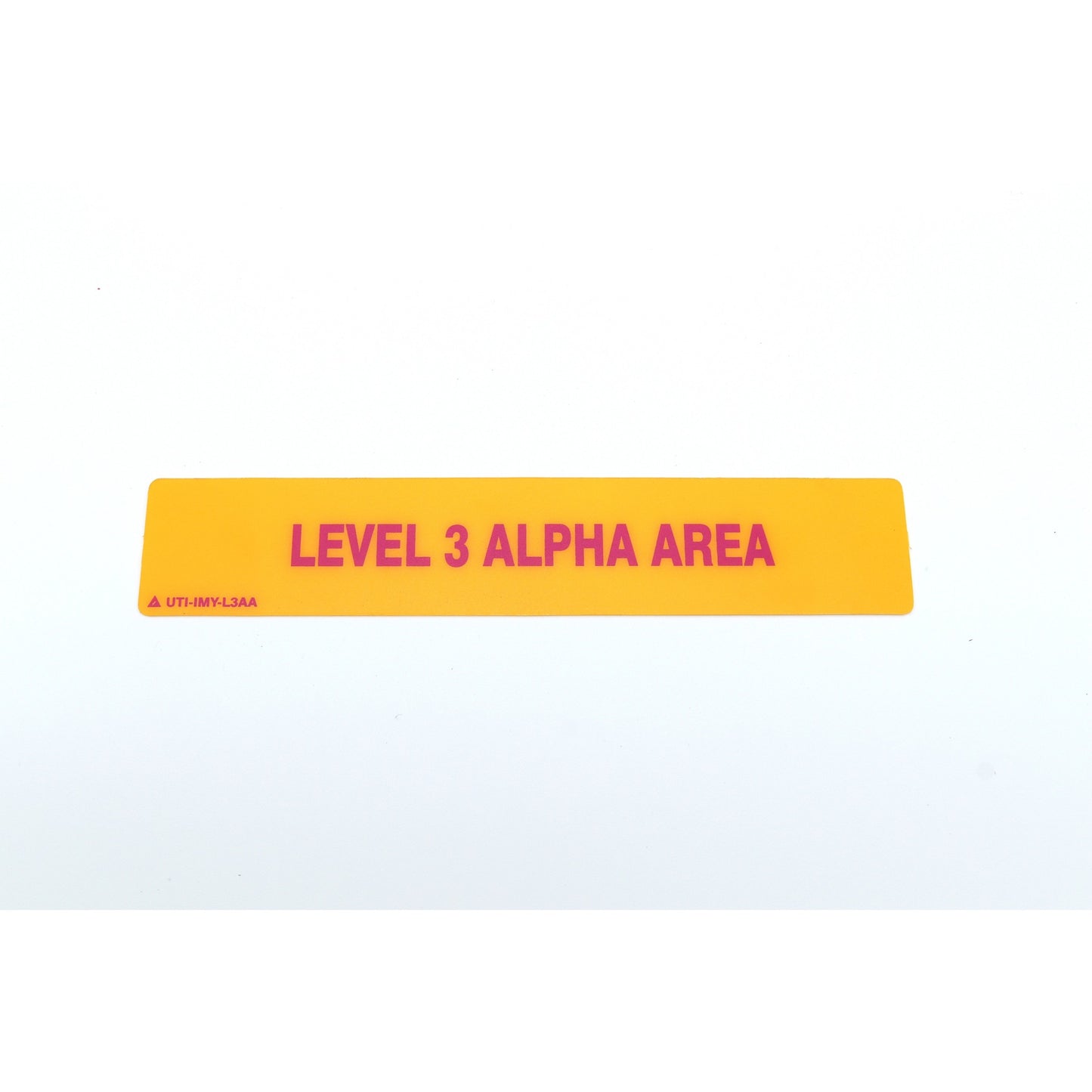 Yellow and pink sign with 'LEVEL 3 ALPHA AREA' text on a white background