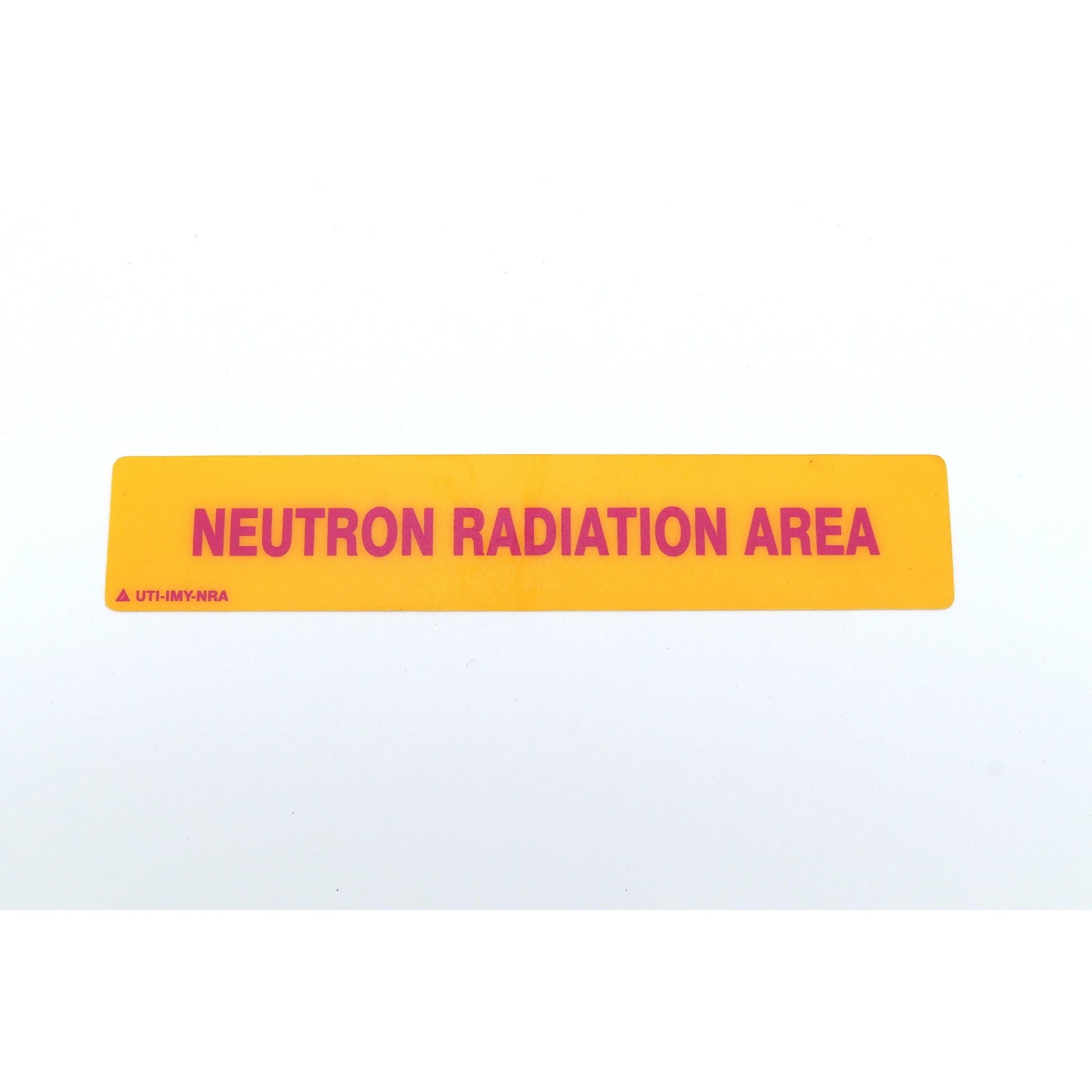 Yellow sign with 'Neutron Radiation Area' text on a white background