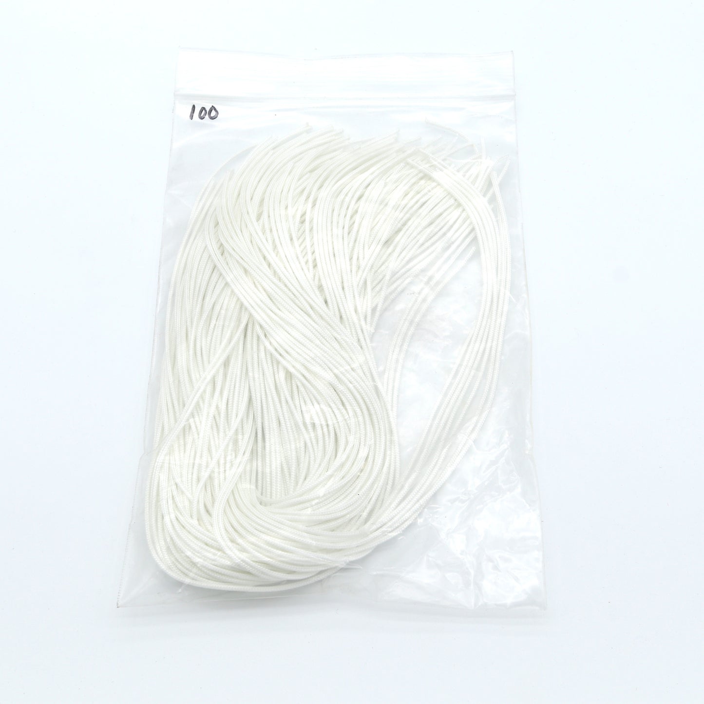 White yarn skein in a clear package on a white background