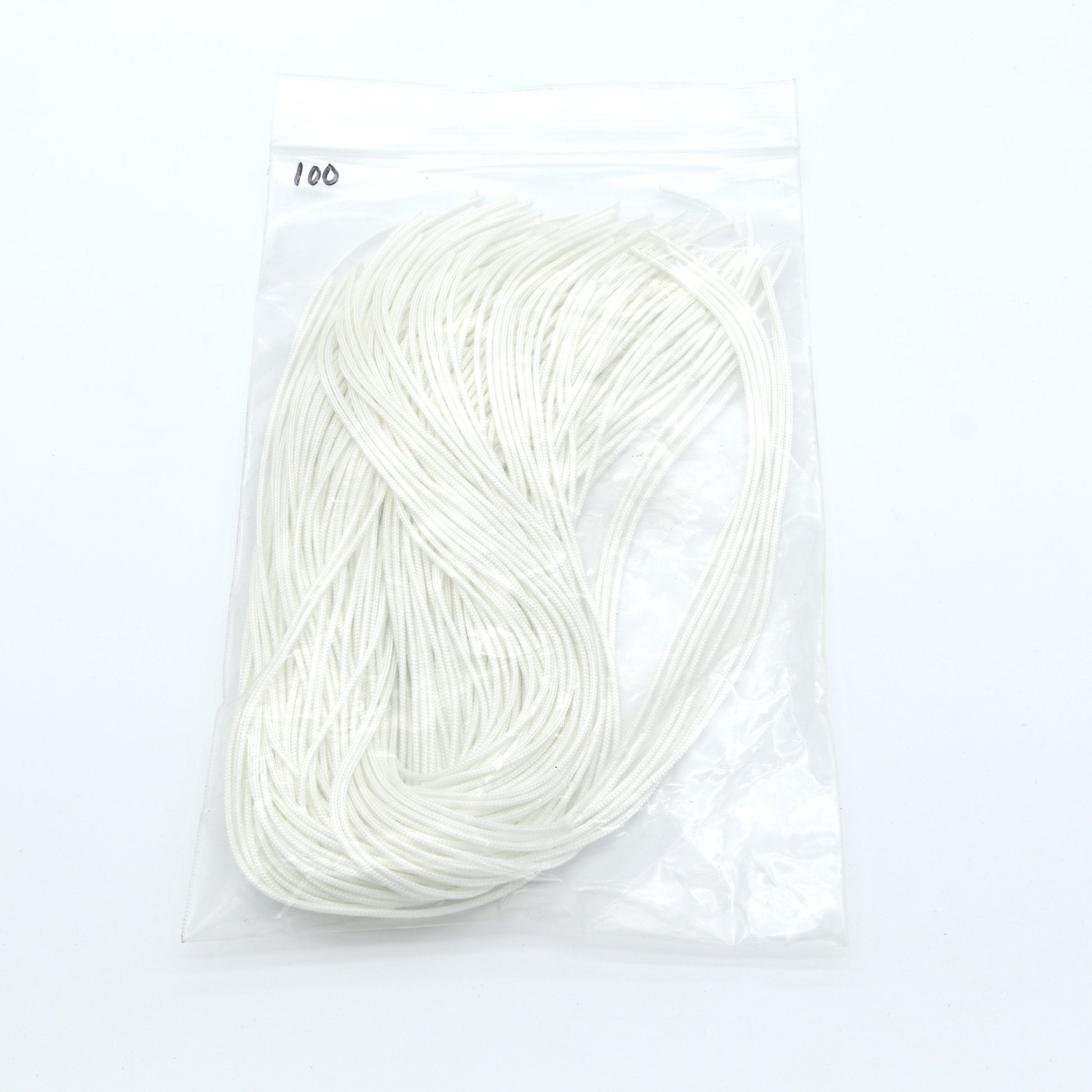 White yarn skein in a clear package on a white background