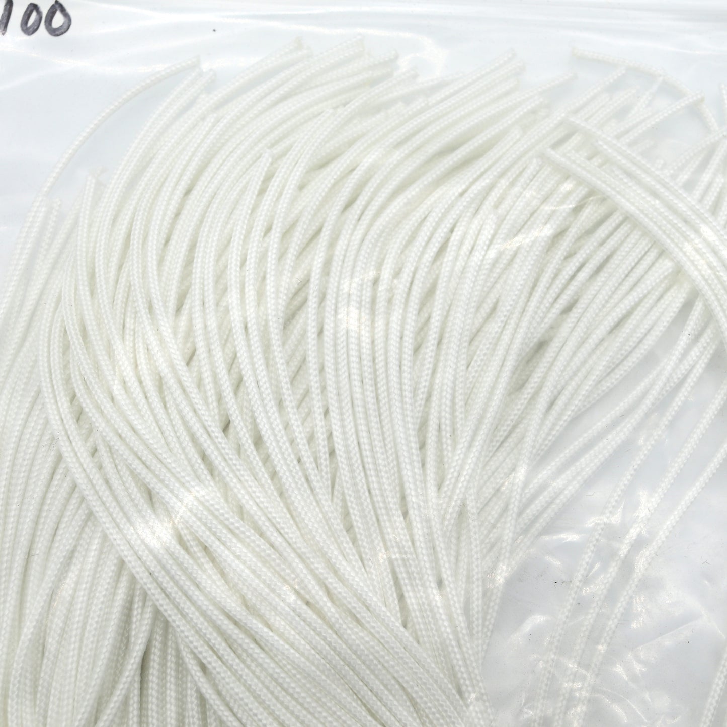 Close-up of white yarn on a clear background