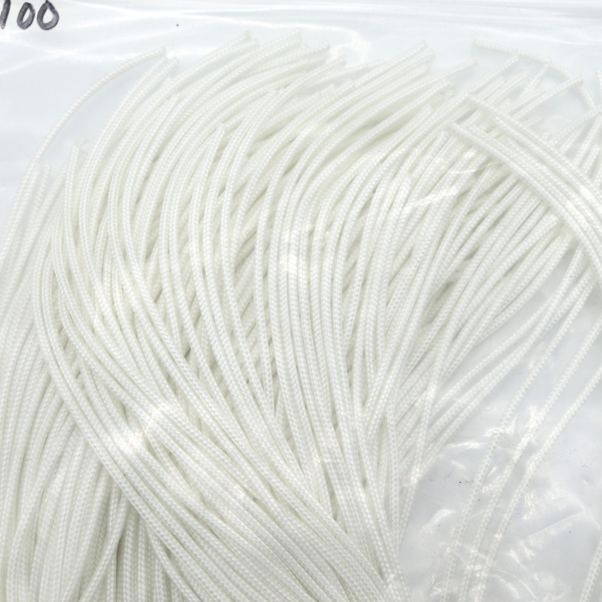 Close-up of white yarn on a clear background