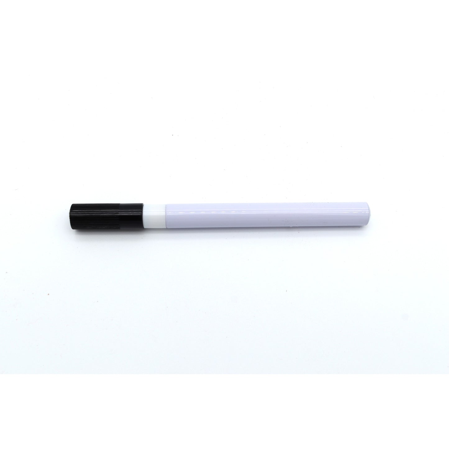 White marker with black cap on a white background