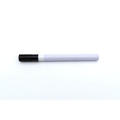 White marker with black cap on a white background