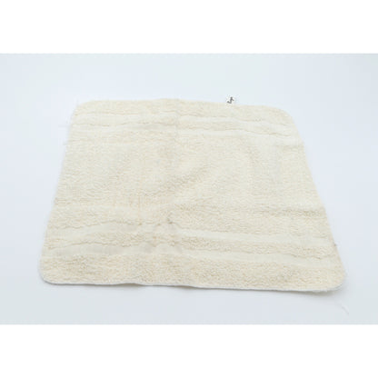 Beige washcloth on a light gray background