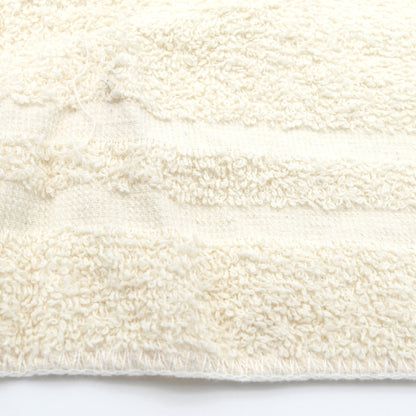 Close-up of a textured white fabric on a white background