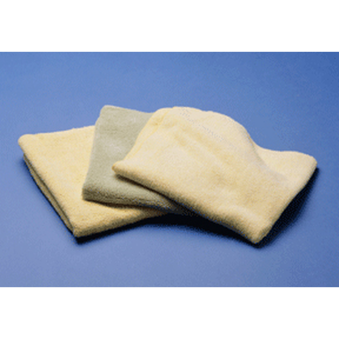 Three beige microfiber towels stacked on a blue background