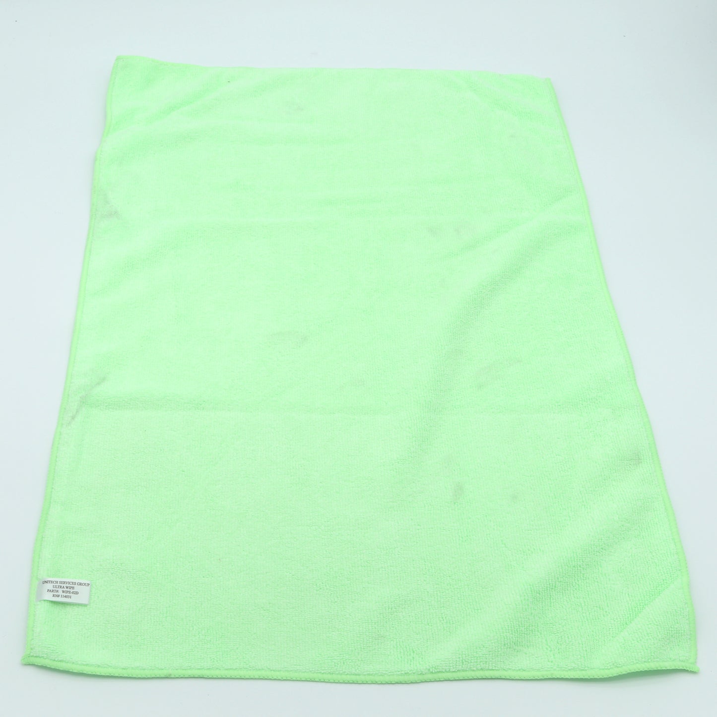 Light green towel on a light gray background