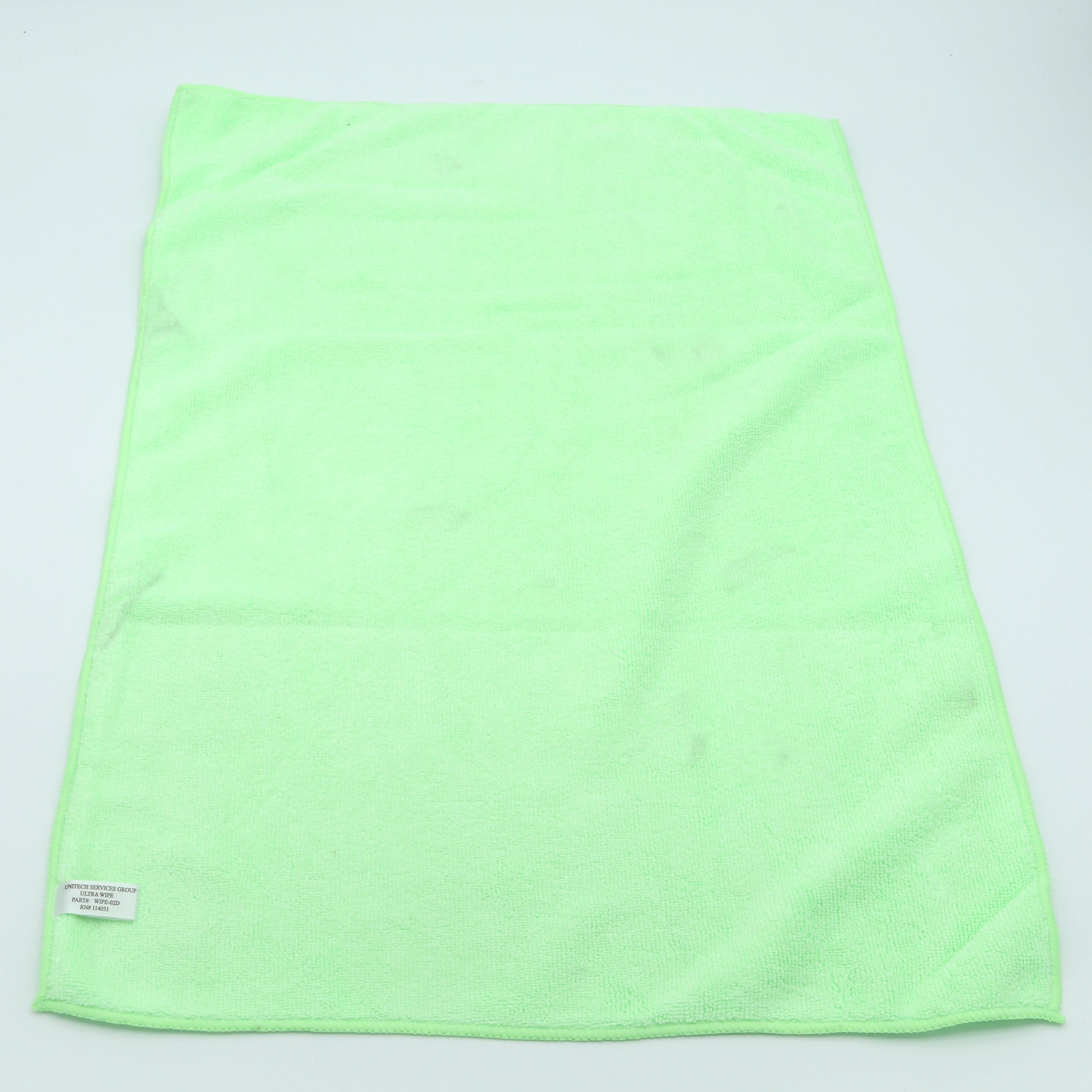 Light green towel on a light gray background