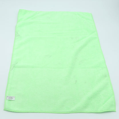 Light green towel on a light gray background