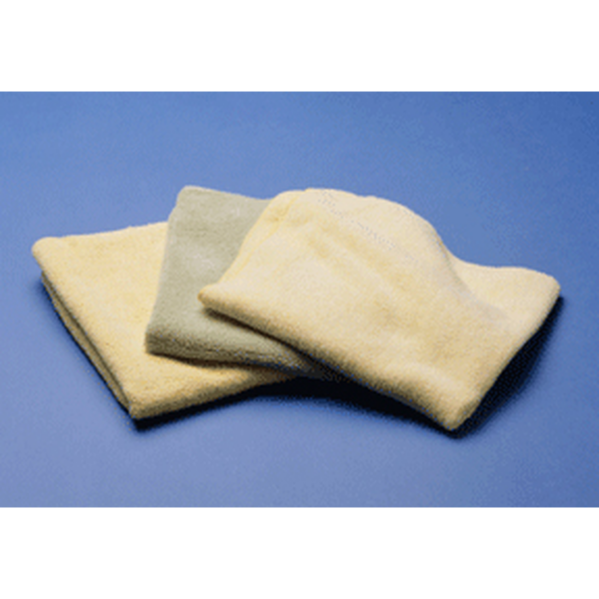 Three beige microfiber towels stacked on a blue background