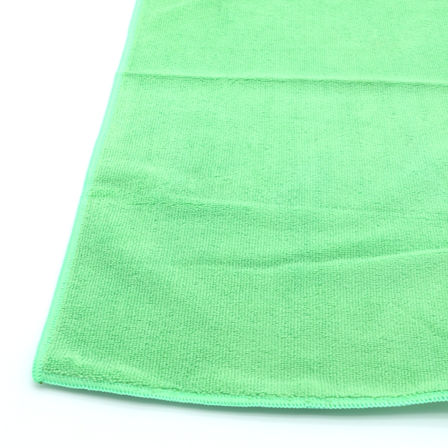Close-up of a green towel on a white background