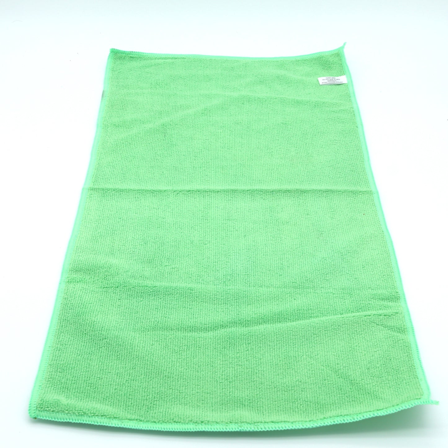 Green towel on a white background