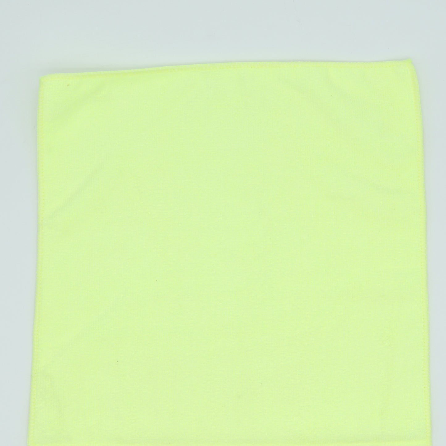 Light green fabric on a light gray background